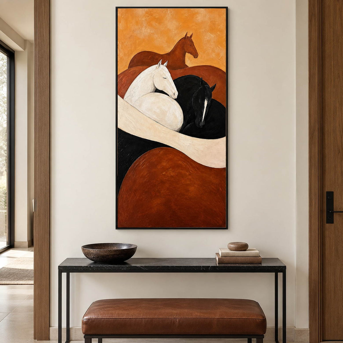 Brown, white, and black horse painting with cream and rust curves in a black frame in an entryway.