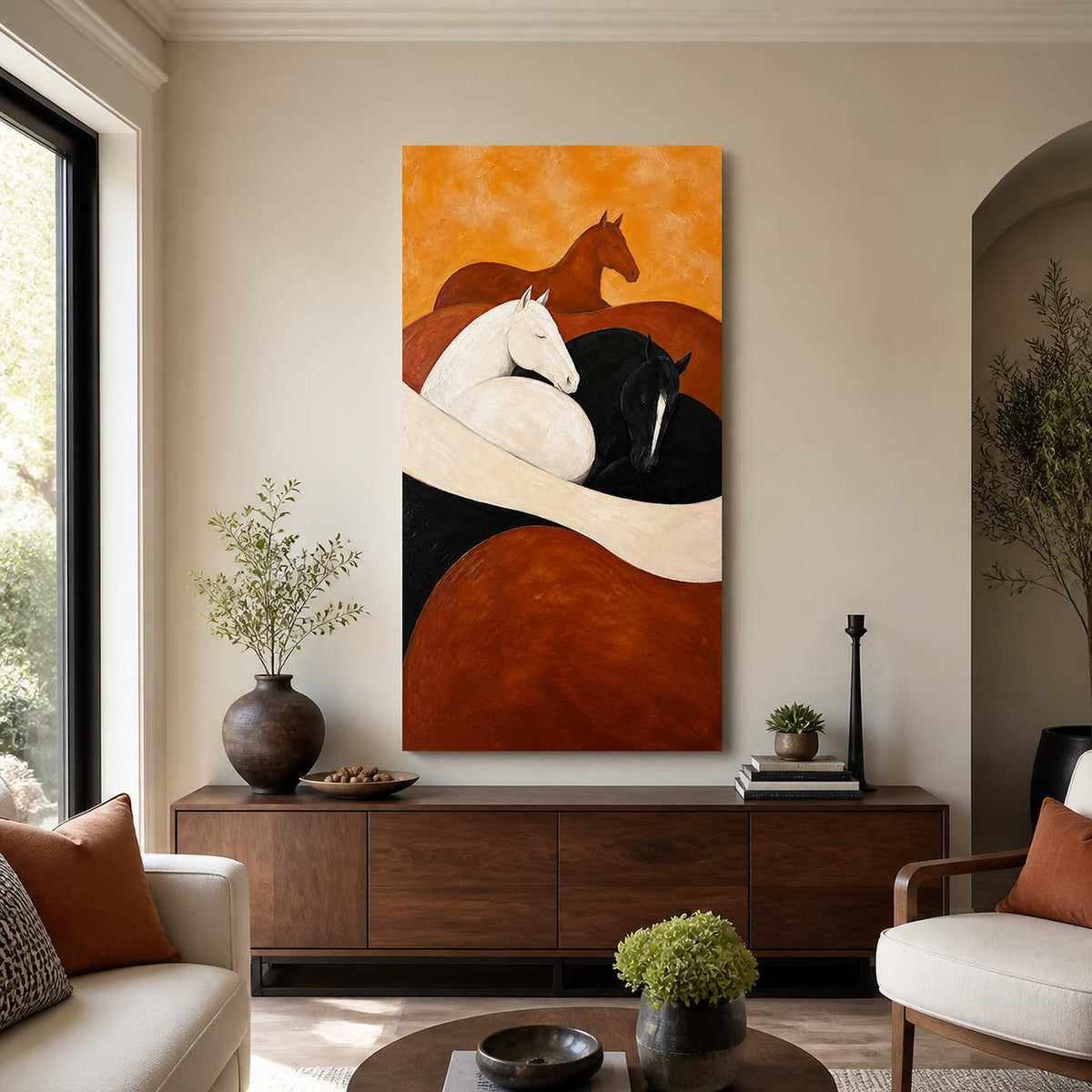 Warm horse artwork above a walnut sideboard between cream living room seating.