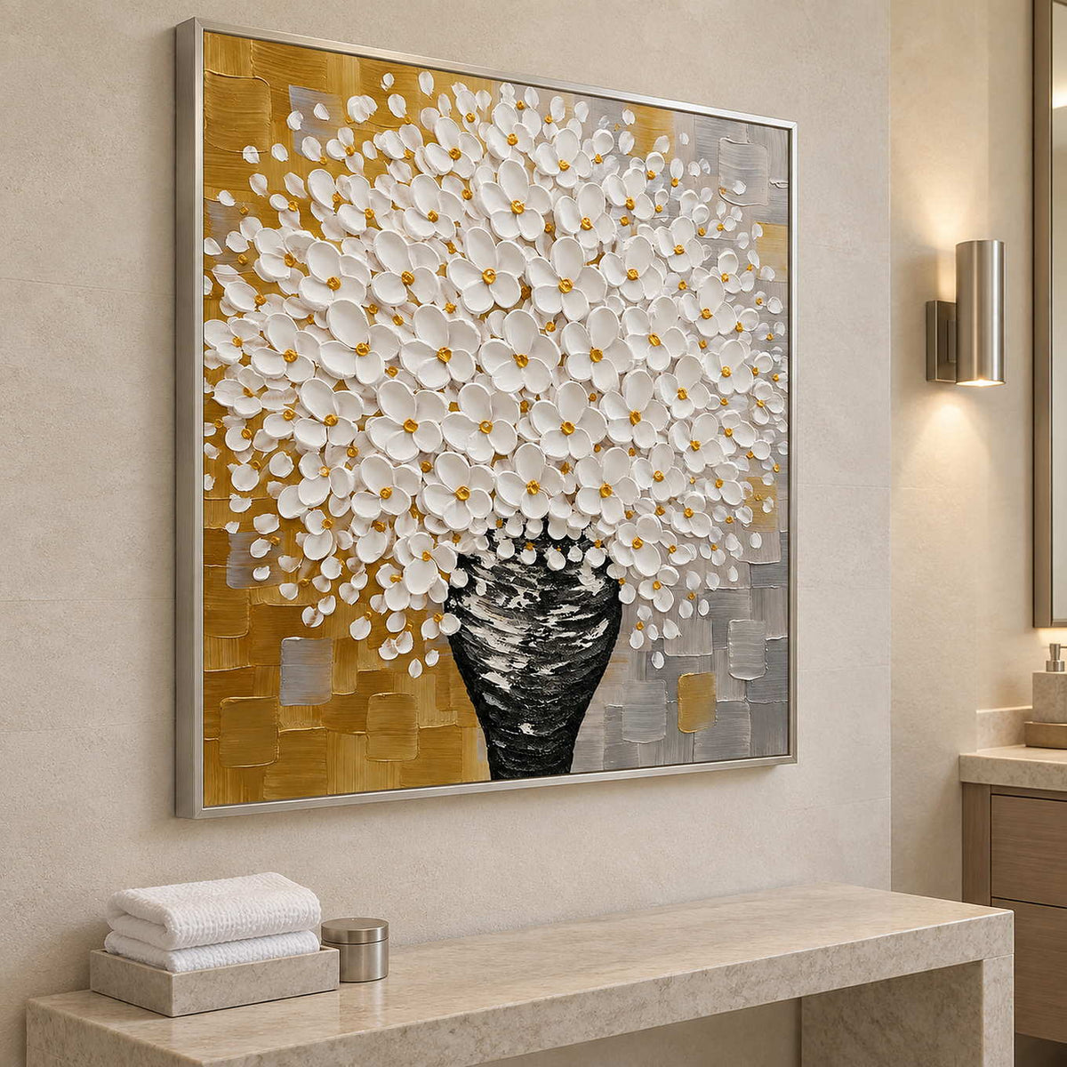 Angled view of the floral painting above a pale console with folded white towels.