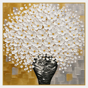 White flowers with golden-yellow centers in a black and white vase against textured ochre and gray blocks.