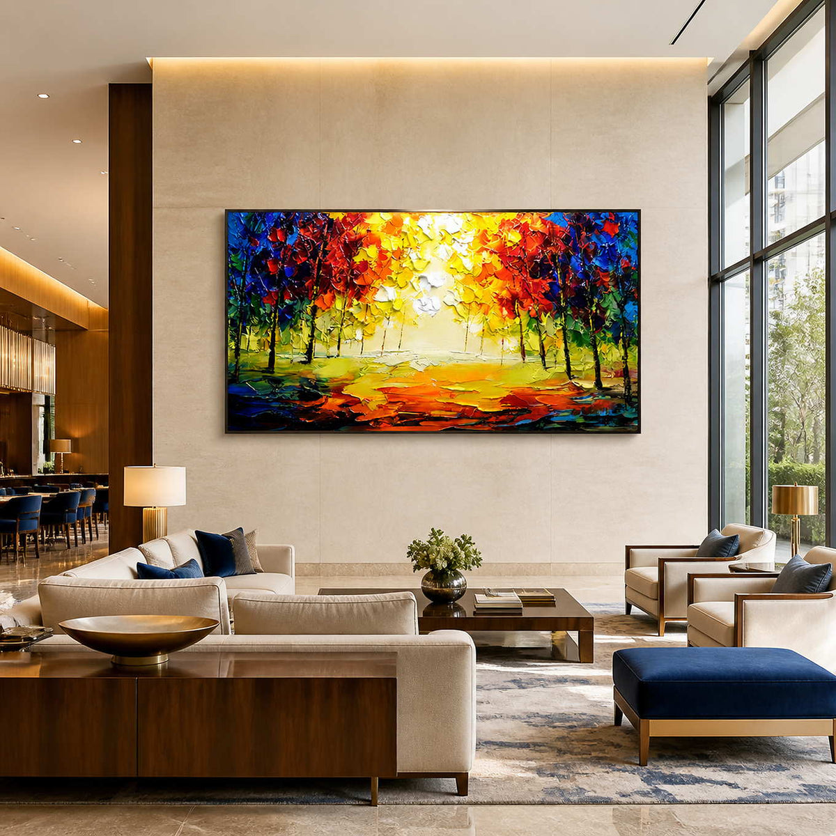 Colorful woodland landscape in a black frame above cream hotel lobby seating.