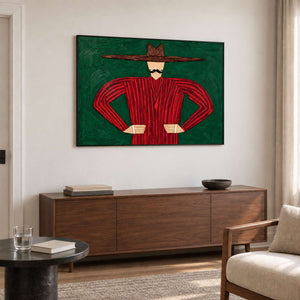 Horizontal red and green portrait over a long brown cabinet in a sitting area.