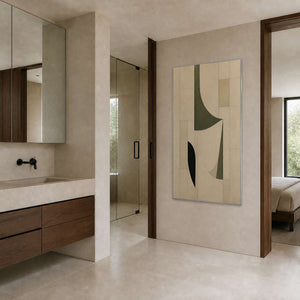 Minimalist vertical canvas viewed in a cream stone bathroom area.