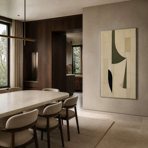 Modern geometric artwork displayed at the end of a walnut dining room.