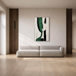 Green and black modern abstract wall art in a warm living room.