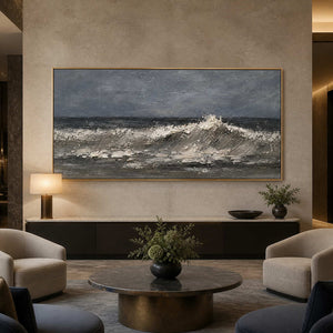 Monochrome coastal artwork displayed in a refined hotel lobby.