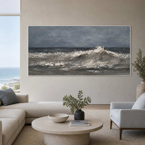 Sculptural ocean wave artwork displayed in an ocean-view lounge.