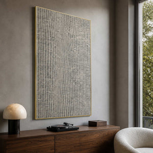 Textured geometric painting displayed in a cool gray listening room.