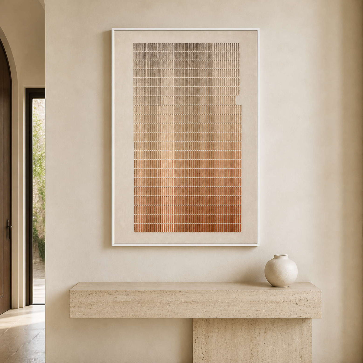 Minimalist textured artwork displayed above a pale stone entryway console.