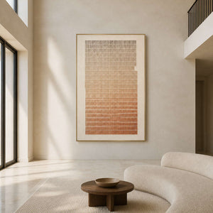Textured minimalist wall art displayed in a bright double-height living room.