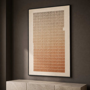 Vertical minimalist relief displayed in a dark contemporary office.