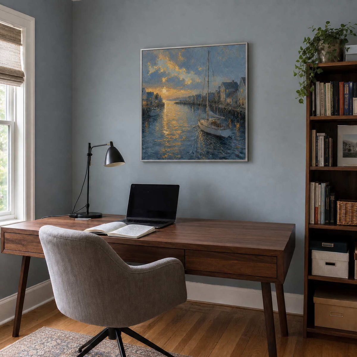 Blue-gray coastal wall art displayed above a desk in a modern home office.