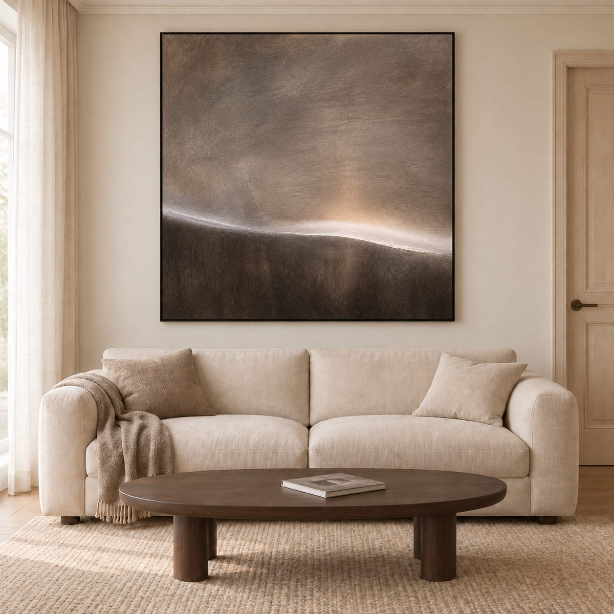 A thin glowing horizon between smoky gray and dark brown fields in a black frame, displayed above a sofa in a living room.