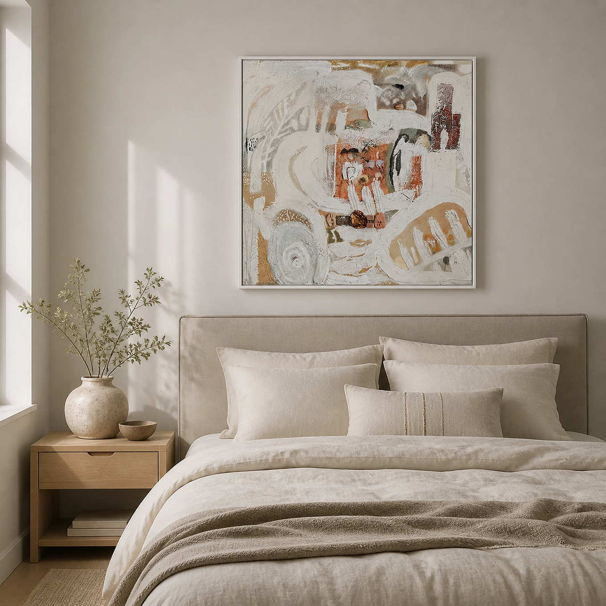 White framed textured abstract artwork above a linen bed in a softly lit bedroom.
