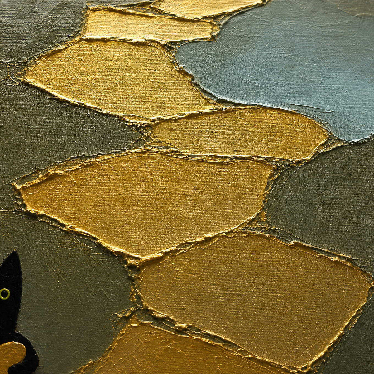 Close-up of raised gold palette-knife edges beside the black cat figure.