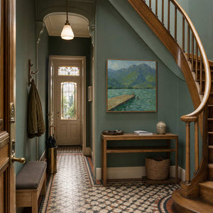 Mountain lake painting adding natural color to an elegant entryway.