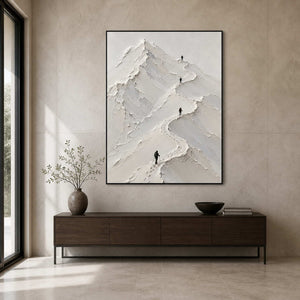 Vertical mountain artwork displayed in a modern stone entryway.