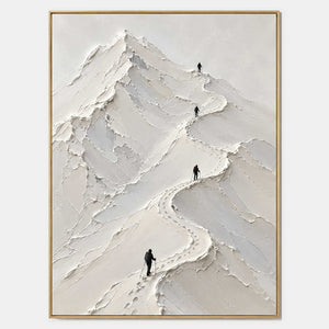 Four climbers following a winding trail across sculpted white mountain peaks.