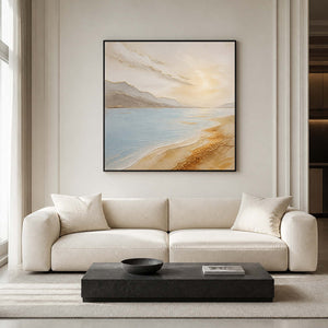 Blue and golden coastal wall art in a modern American living room.