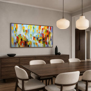Colorful panoramic wall art displayed above a dark wood dining room console.