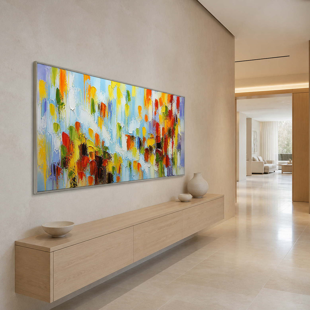 Bright abstract wall art creating an uplifting focal point in a long entryway.