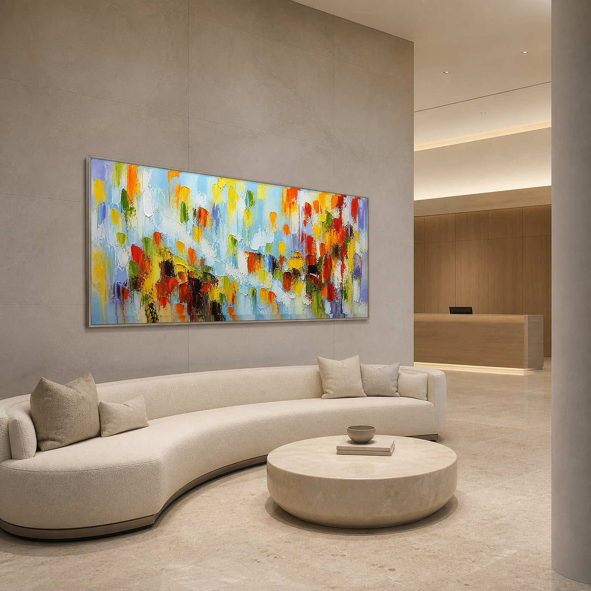 Panoramic multicolor wall art displayed in a spacious modern hotel lobby.