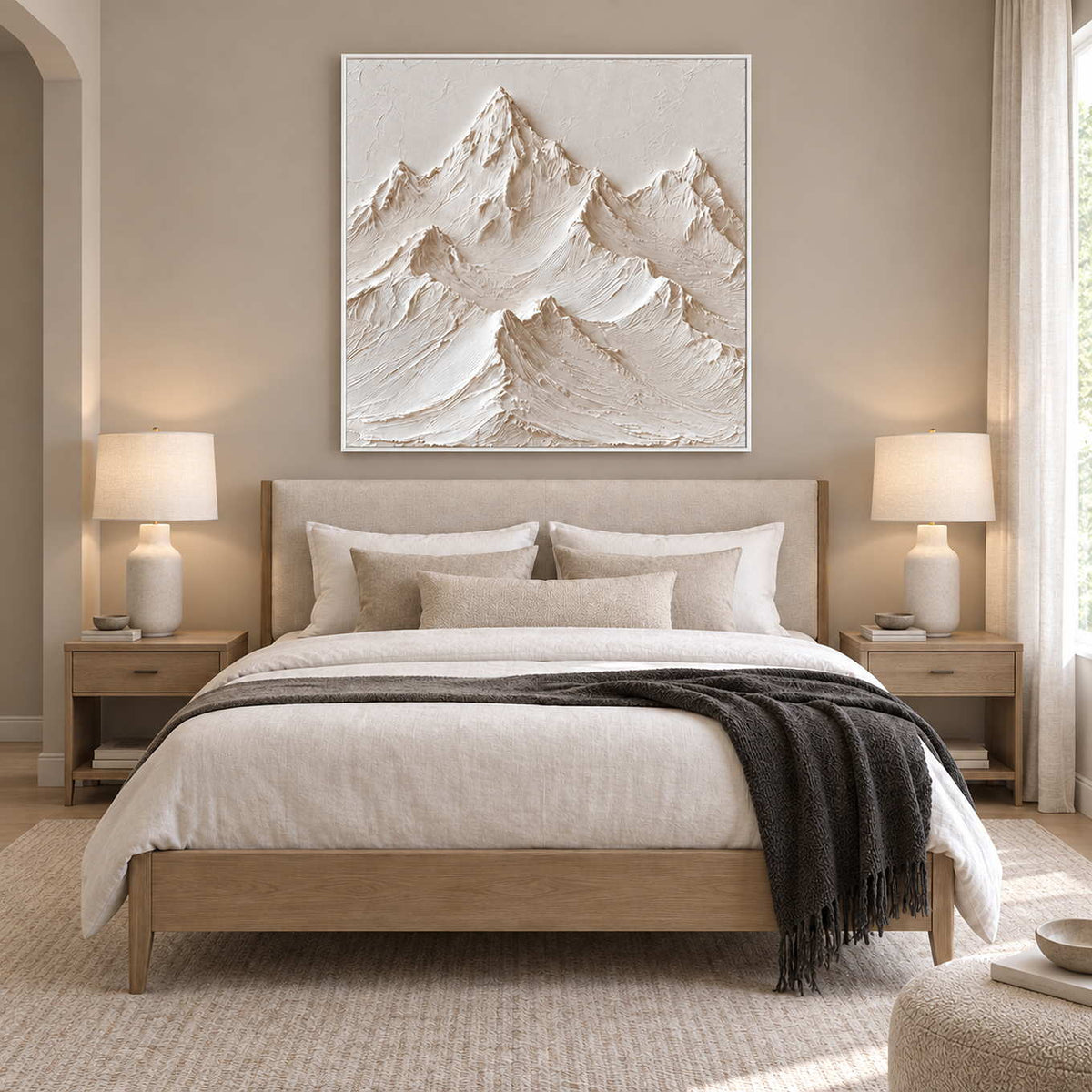 The Mountains Stand Watch in a white frame above a wood bed with white linen and a dark gray throw.