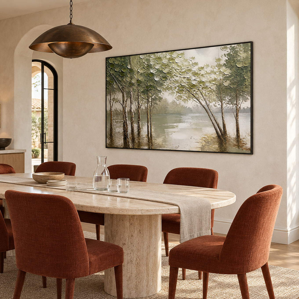 Horizontal forest landscape artwork with olive trees and pale reflective water, displayed in a dining room in a black frame.