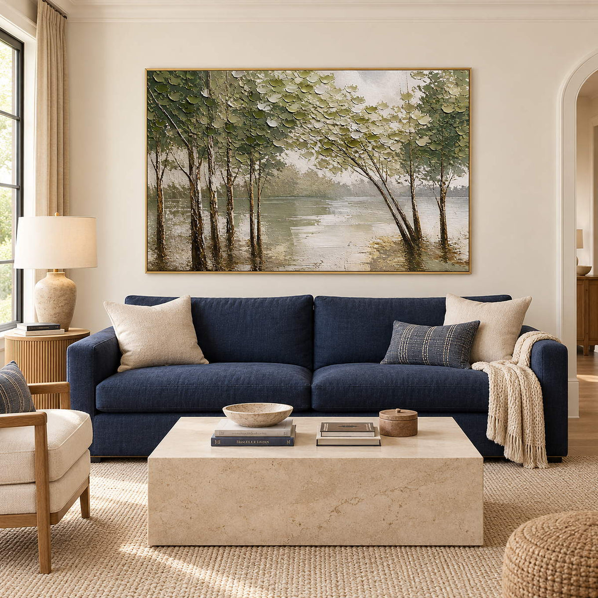 Horizontal forest landscape artwork with olive trees and pale reflective water, displayed in a living room in a gold frame.