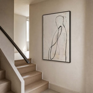 Black line figurative artwork viewed beside a warm residential staircase.