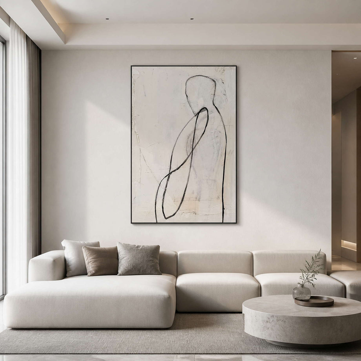 Minimalist figurative wall art displayed above a warm white modern living room.