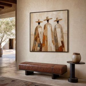 Earth-tone figurative wall art above a refined entryway bench.