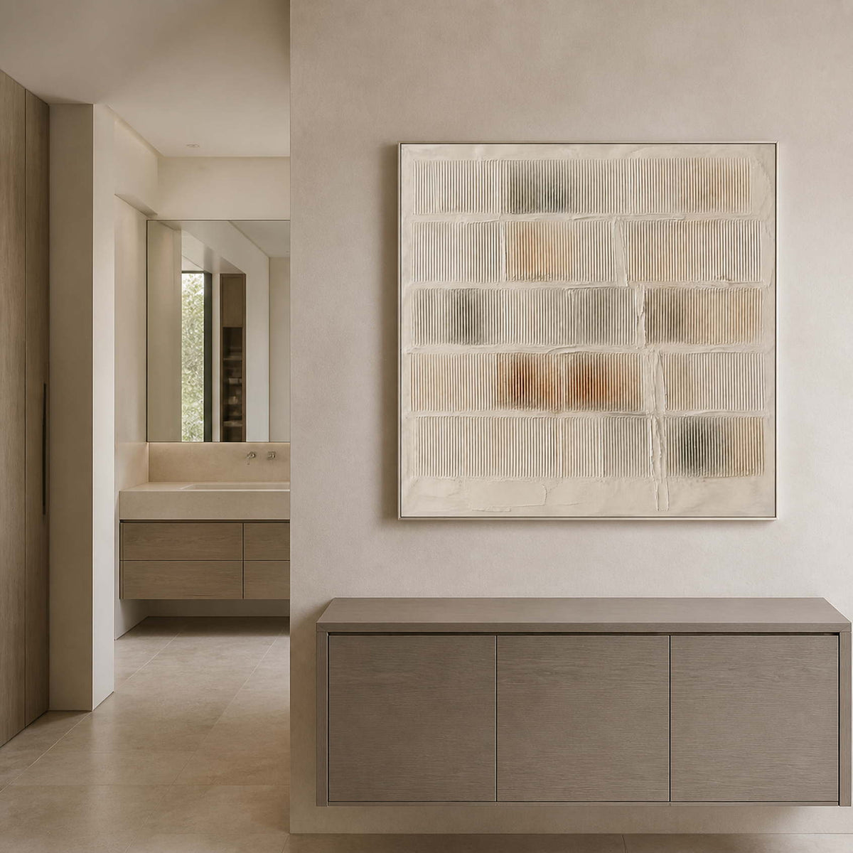 Warm white textured wall art displayed in a pale stone bathroom area.