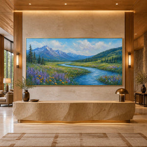 Wide mountain river wall art displayed in a boutique resort lobby.