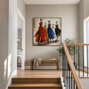 Five-figure fashion wall art displayed on a bright residential stair landing.