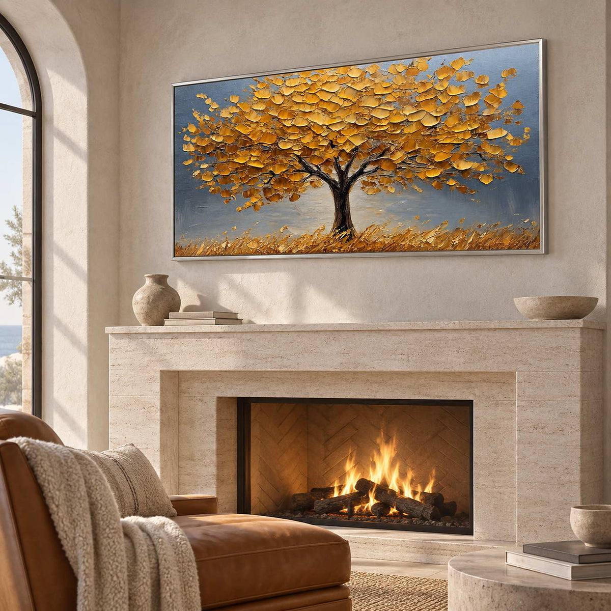 Golden tree artwork above a lit pale fireplace near a brown chaise.