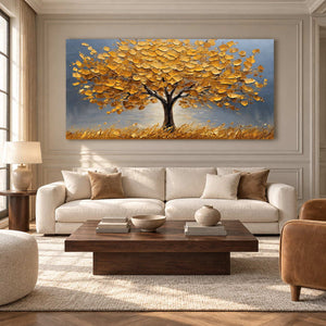 Golden-canopy tree painting above a cream sofa with a low dark wood coffee table.