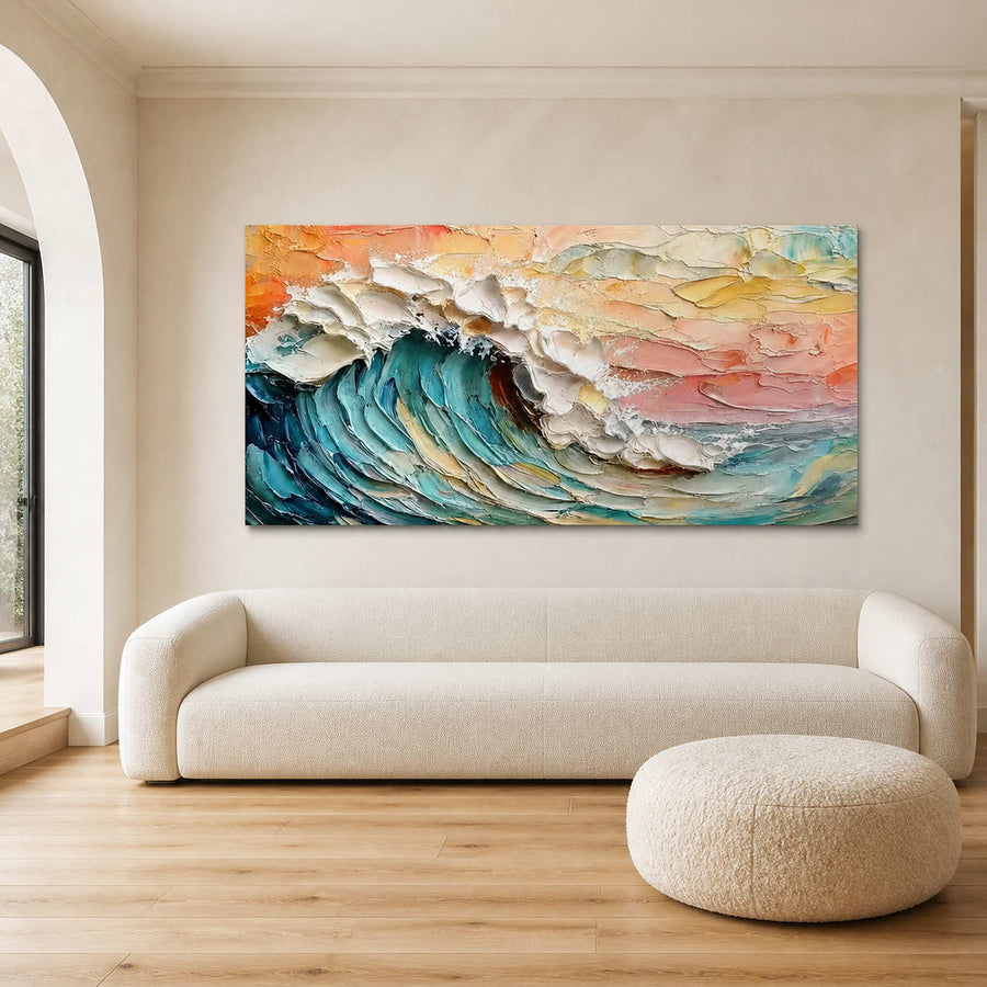 Frameless turquoise wave painting above a curved cream sofa beside an arched window.