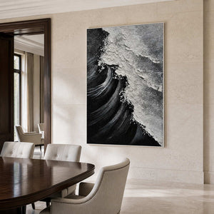 White framed textured wave artwork above upholstered chairs in a formal dining room.