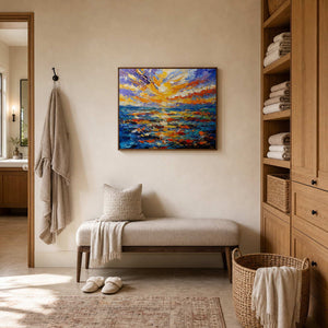 Textured sunset seascape brightens a primary bathroom dressing area.