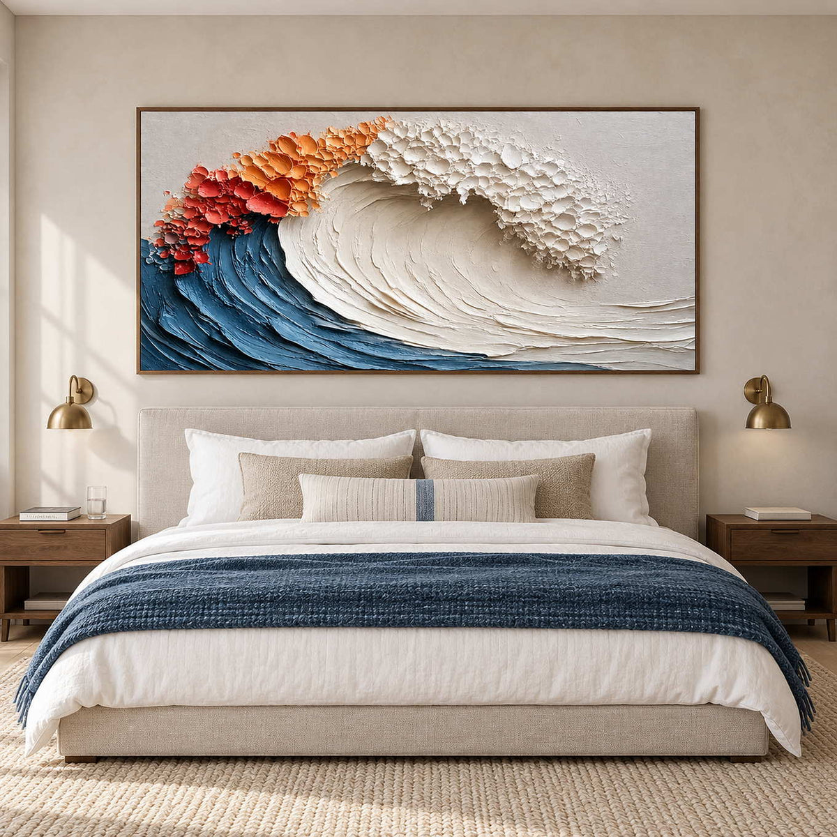 Textured wave over a cream bed with a navy throw and paired bedside sconces.