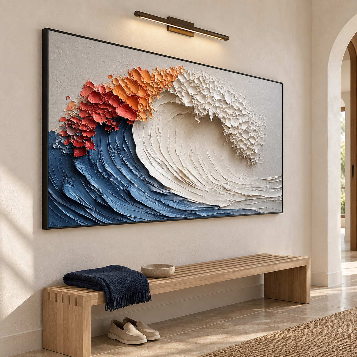 Blue-wave painting over a slatted wooden entryway bench beneath a picture light.