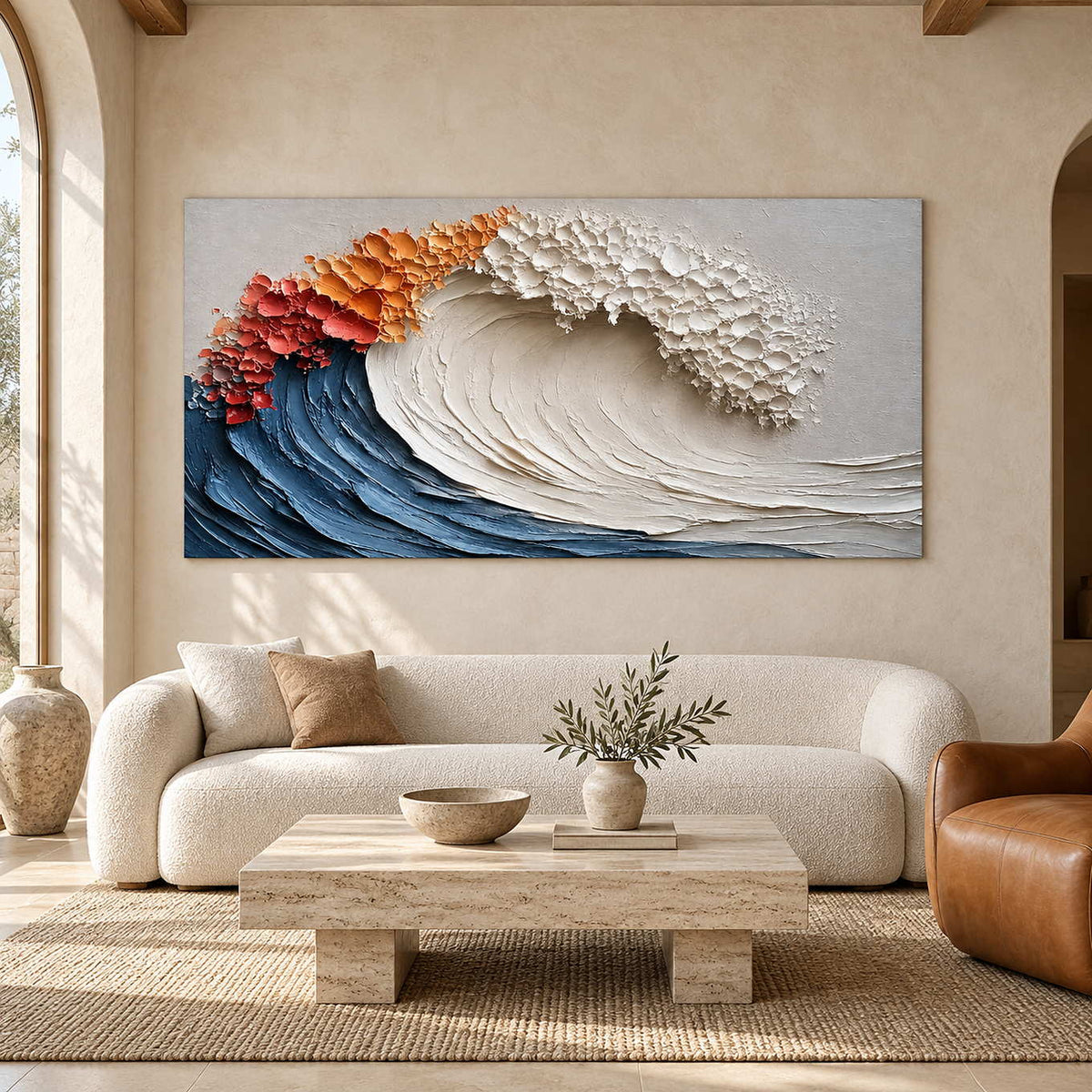 Sculptural-looking wave artwork above a curved cream sofa and pale rectangular coffee table.