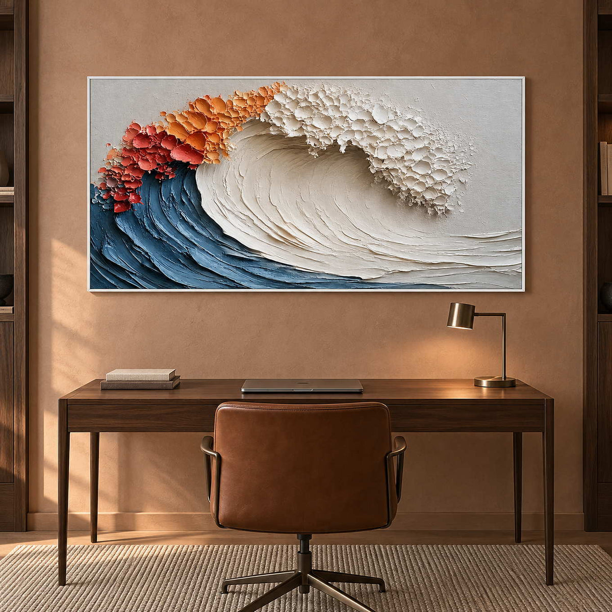 Coral-and-white crest painting above a dark desk on a warm terracotta wall.