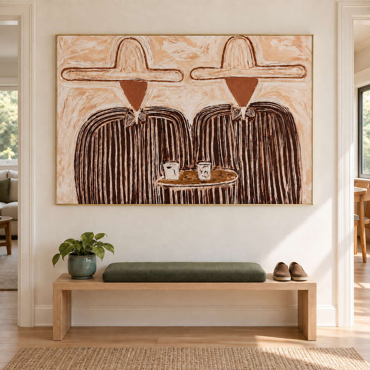 Cup-and-figure artwork above an entry bench with a green cushion.