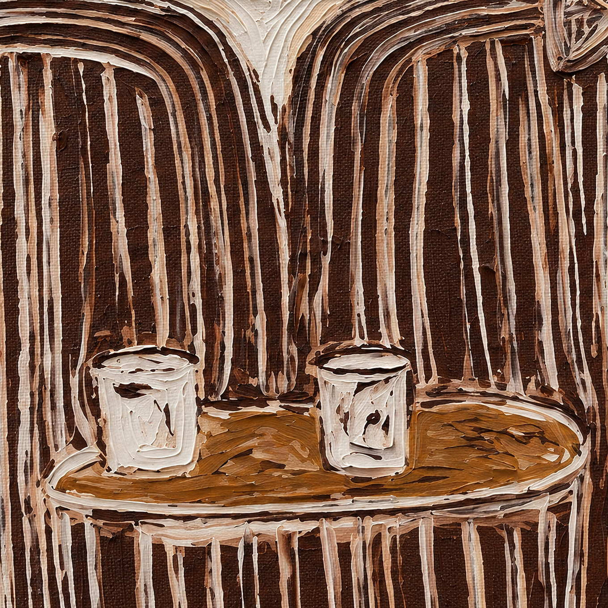 Detail of two white cups on a round brown table beneath striped clothing.