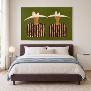 Two-figure artwork above a plum bed with pale blue bedding.
