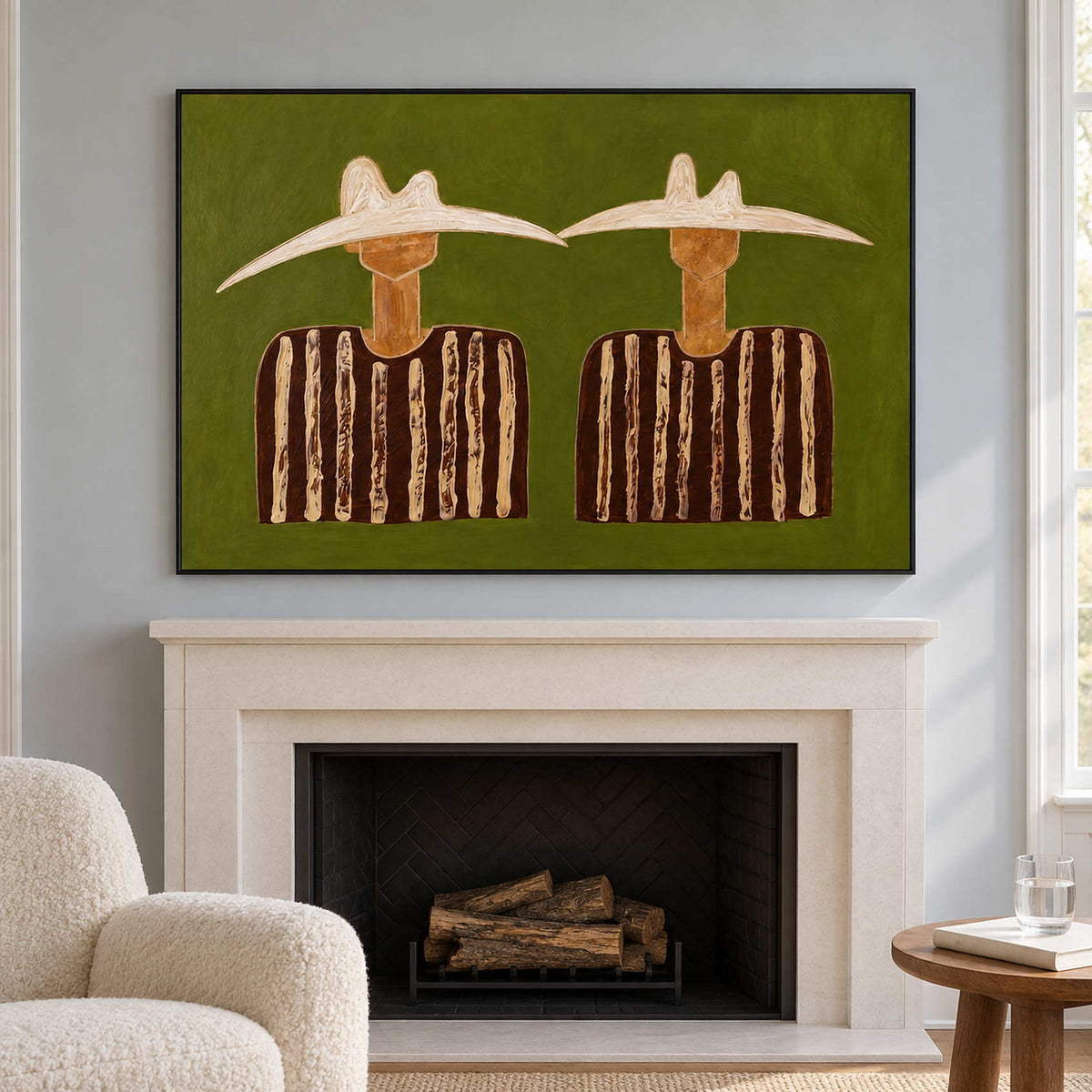 Black-framed pair above a white fireplace on a blue wall.
