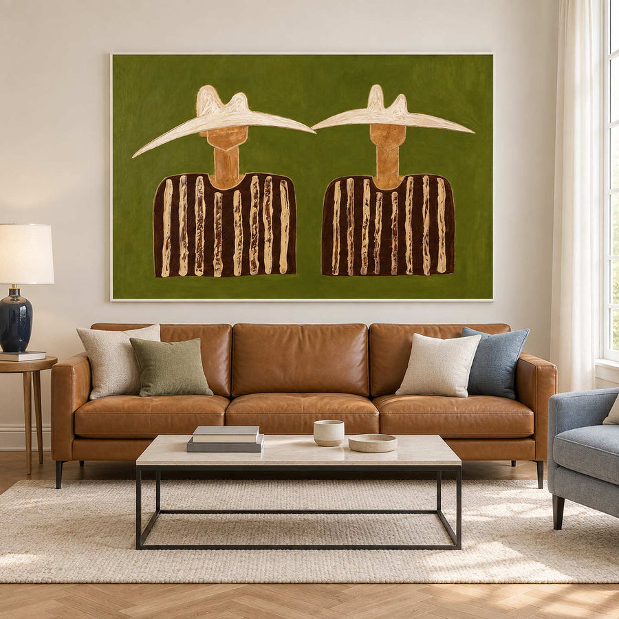 Cream-hat pair above a tan sofa and rectangular coffee table.