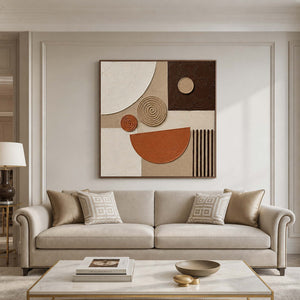 Square textured boho wall art displayed above a refined neutral living room sofa.